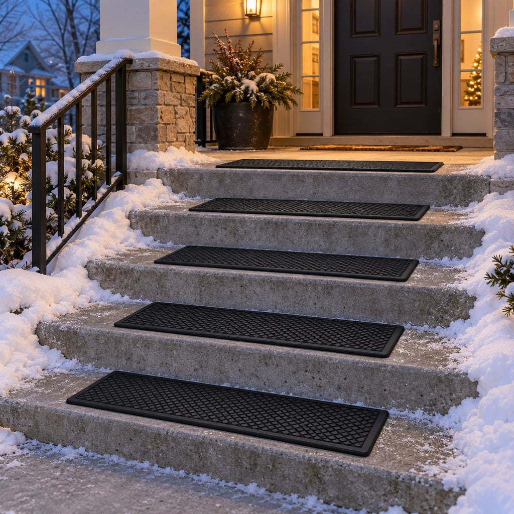 Concrete porch steps fitted with black rubber stair treads in winter